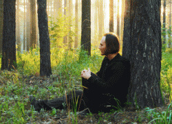 Contemplating in a secluded forest
